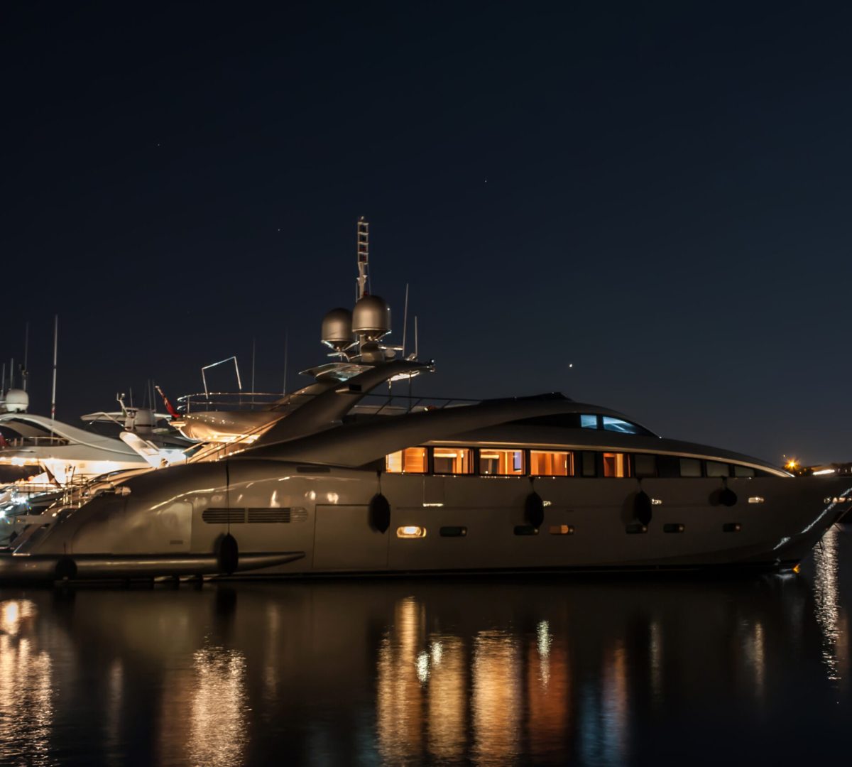Imagine concluding your day of bespoke exploration with the serene glow of your private luxury yacht, reflecting the tranquility of a Mediterranean evening. Every detail, from the illuminated decks to the gentle lapping of the water, awaits your return from an exclusive shore excursion.